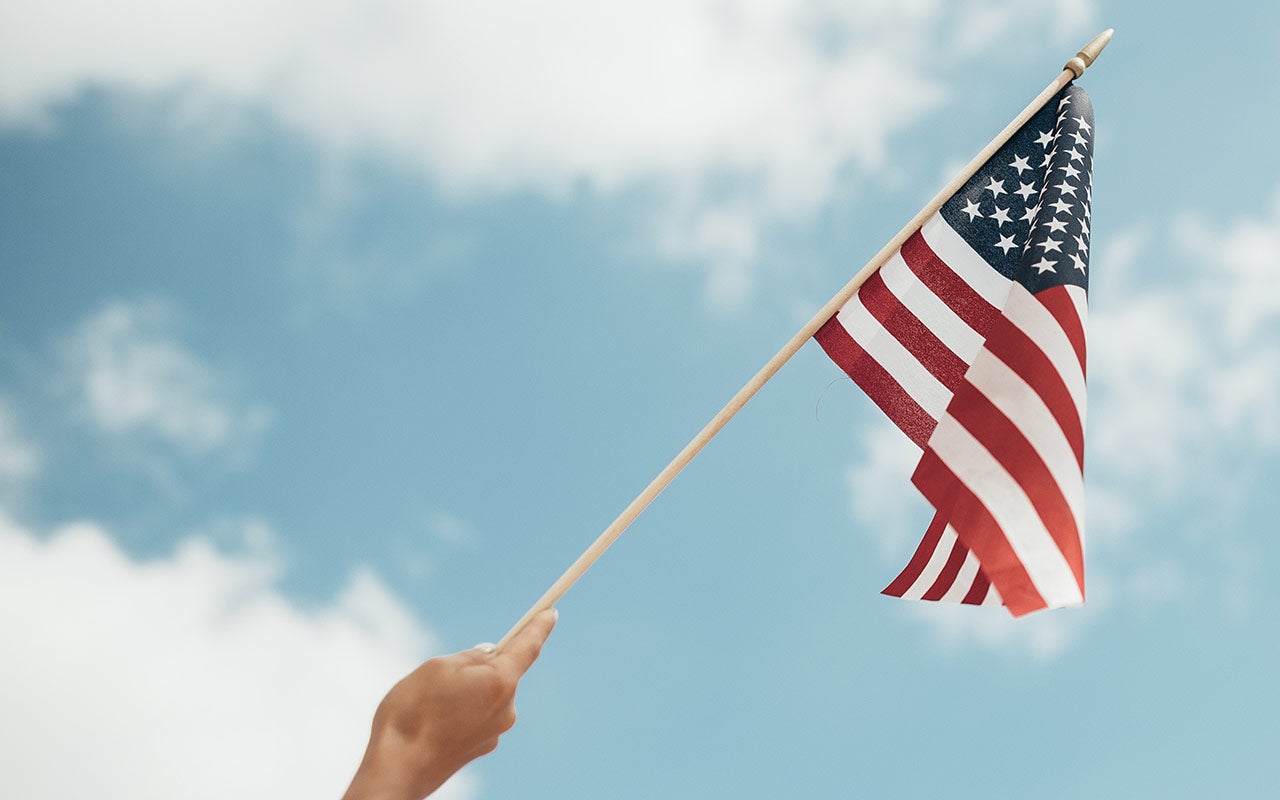 flag, blue sky, hand