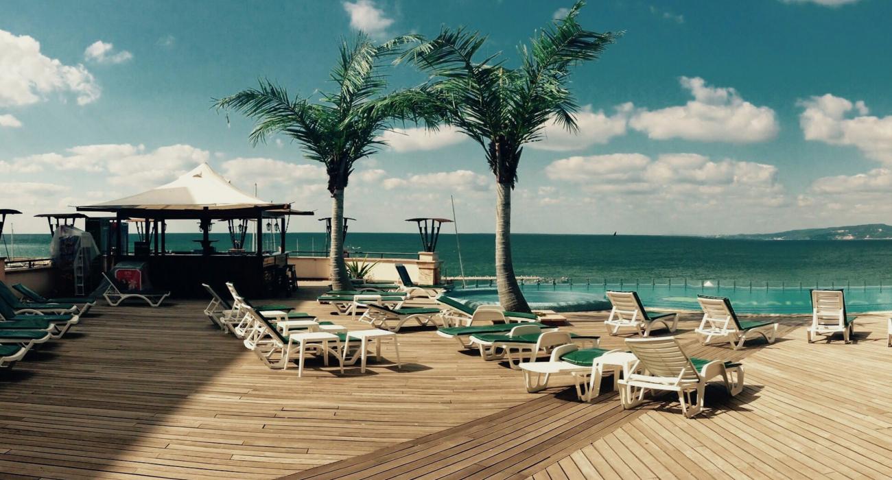 View of the ocean and palmtrees from a beach resort