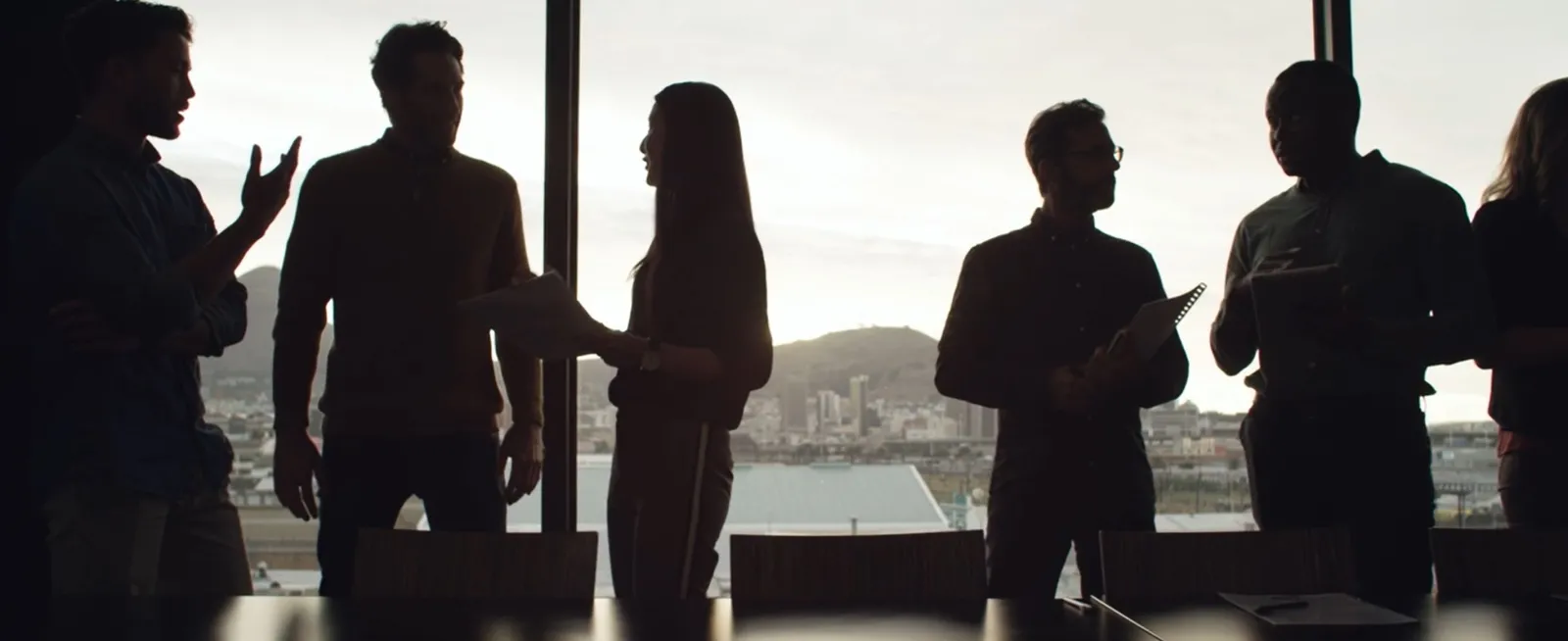 People standing next to a window