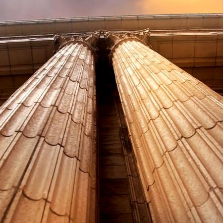Shot of marble Corinthian columns from below.