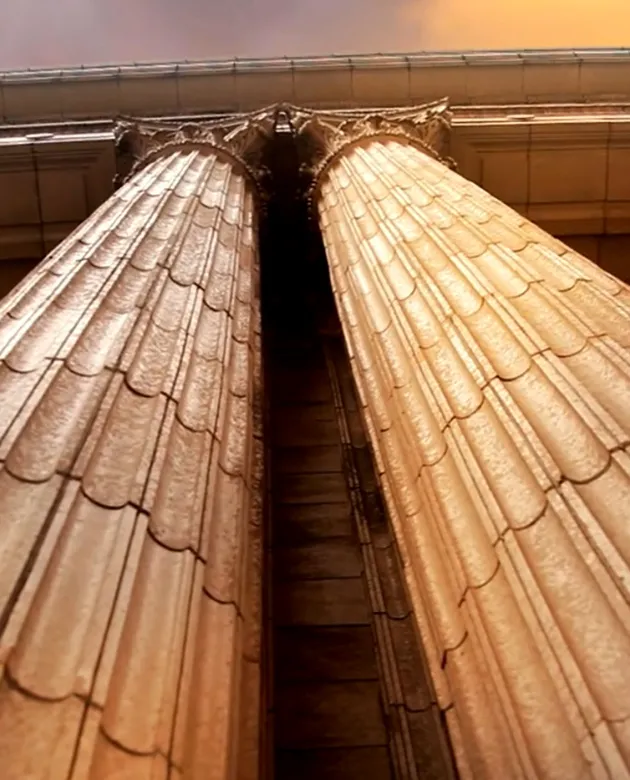 Shot of marble Corinthian columns from below.